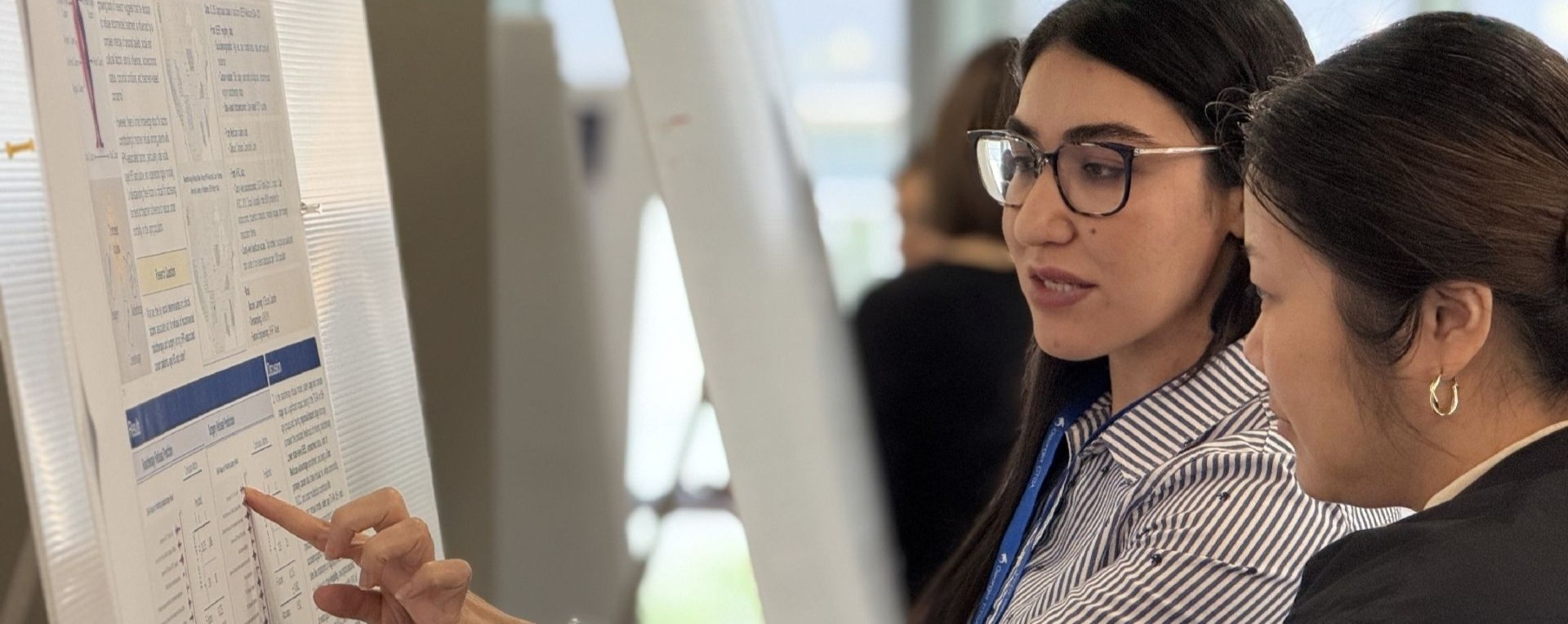 researcher presenting poster