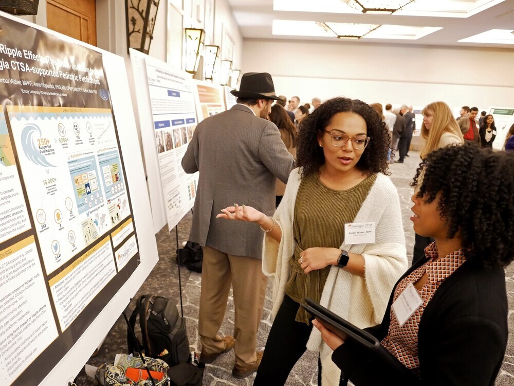 researcher presenting poster