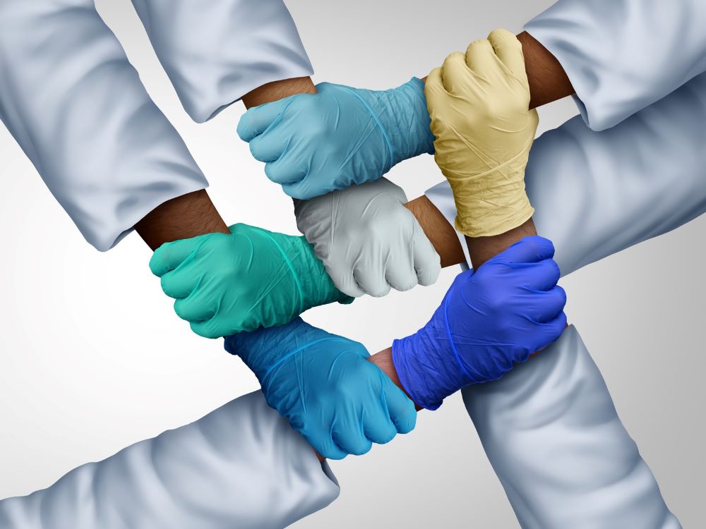 Doctors holding hands in unity