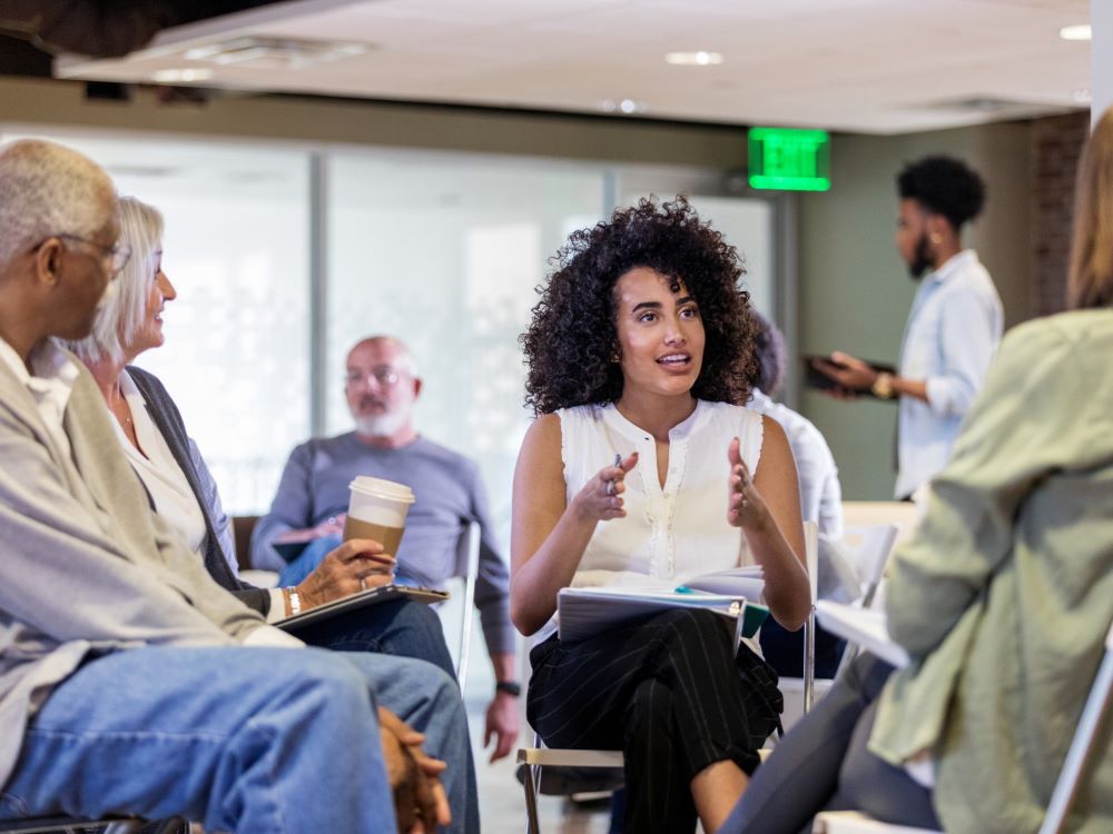 researcher discussing with community members