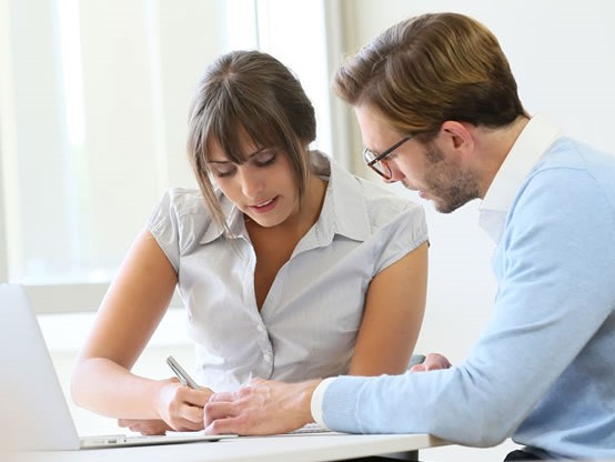 researchers reviewing documents