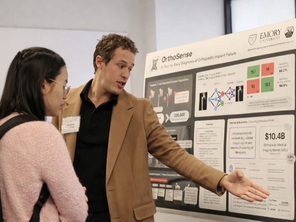 researcher discussing poster