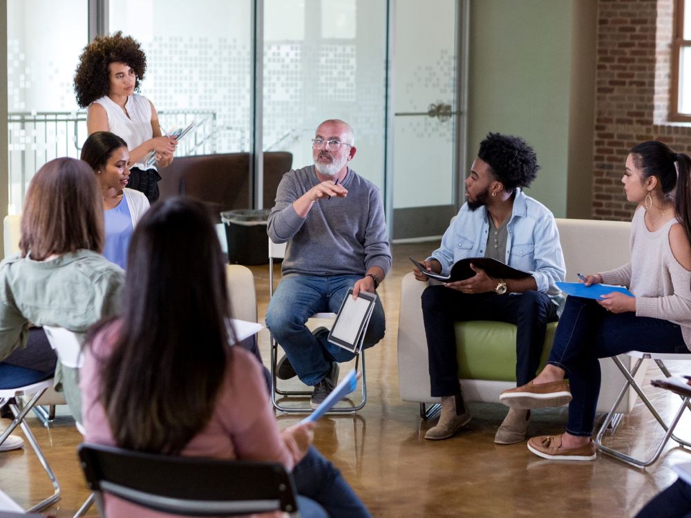 focus group participants sitting in a circle