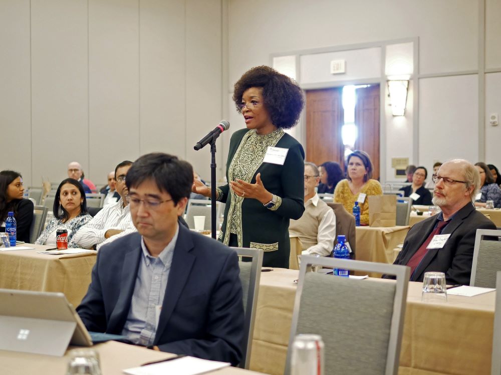 Woman presenting at a conference