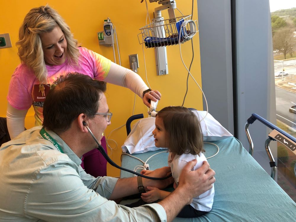 Pediatricians with a child