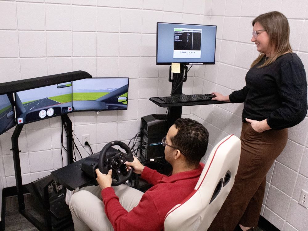 researcher observing a driving stimulation