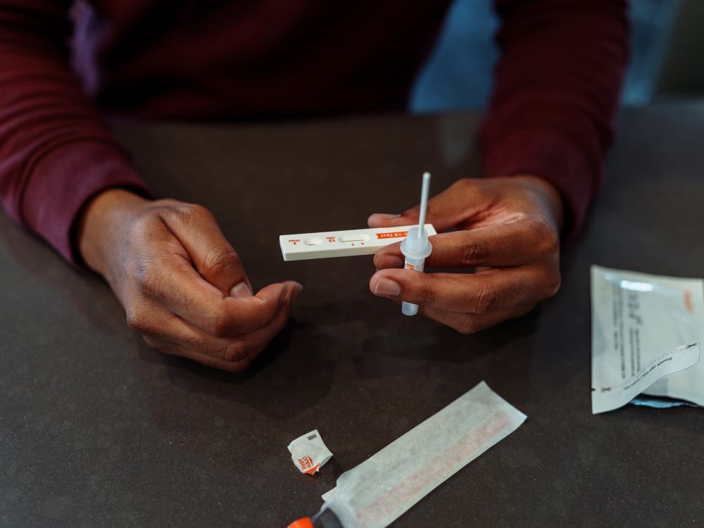 man holding diagnostic test